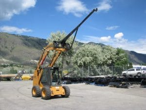 Skid steer lifting boom