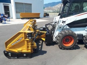 HLA snow wing 8-13 ft mounted on bobcat skid steer