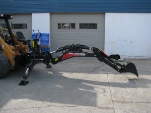 Wallenstein skid steer backhoe mounted on a Case skid steer extended position