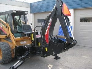 Wallenstein skid steer backhoe mounted on a Case skid steer