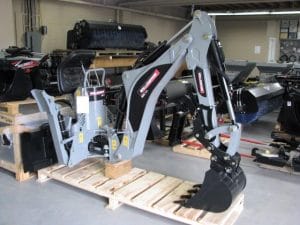 Wallenstein backhoe for skid steer or tractor on a pallet