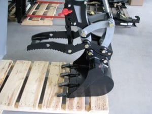 skid steer backhoe tooth bucket and mechanical thumb