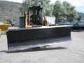 skid steer dozer blade mounted on Case Skid Steer
