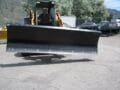 skid steer dozer blade mounted on Case Skid Steer