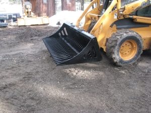 Rock Grapple attached to Skid Steer