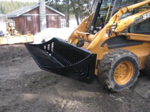 Rock Grapple attached to Skid Steer