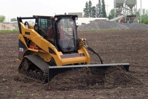 Erskine dozer blade on a Cat tracked skid steer