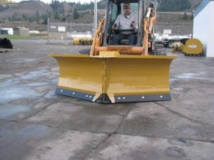 HLA V-blade snow blade mounted on a Case Skid Steer