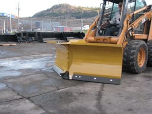 HLA V-blade snow blade mounted on a Case Skid Steer