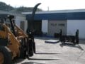 HLA Single Arm Grapple mounted on Case skid steer