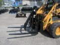 HLA Single Arm Grapple mounted on Case skid steer