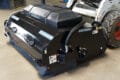 Blue Diamond Pick Up Broom with water kit mounted on skid steer