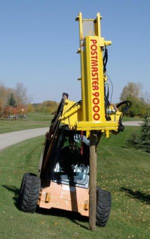 Postmaster 9000 on skid steer pounding a post