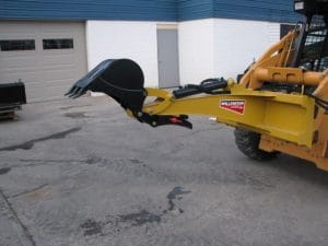 Skid Digger back hoe for skid steer showing mechanical thumb and bucket