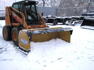 HLA snow pusher and Case skid steer pushing snow