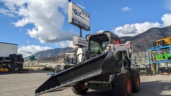 Tilt Plate tilt plate with bucket mounted on Bobcat