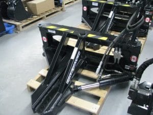 Skid steer tree puller in closed position