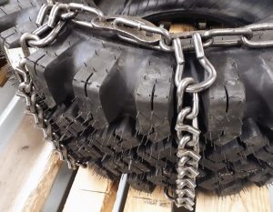 winter tire chain V-bar style on a skid steer tire
