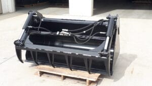 Skid steer bucket with grapple