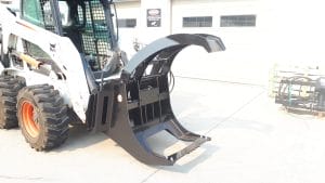 Martatch Log Grapple in open position mounted on a Bobcat skid steer