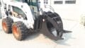 Martatch Log Grapple mounted on a Bobcat skid steer