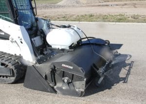 Erskine Pick up Broom with Water Kit mounted on skid steer