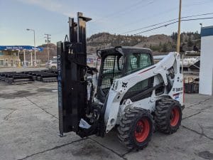 Post Master 9000 mounted on bobcat skid steer