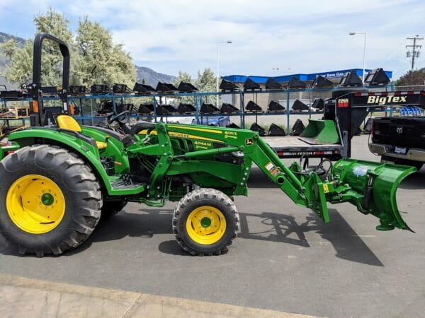 HLA 2000 snow blade on JD4044 with 400E loader HLA 2000 series 90" snow blade with JD440/540 quick attach mounted on JD tractor