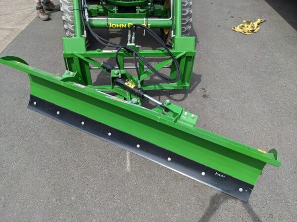 HLA 2000 snow plow top view HLA 2000 series 90" snow blade with JD440/540 quick attach mounted on JD tractor top view