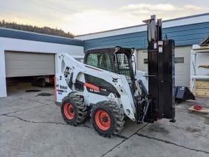 Postmaster 9000 mounted on Bobcat skid steer