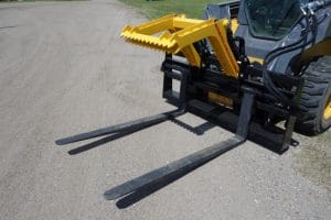 Mat Grapple mounted on skid steer