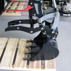 Wallenstein Skid Steer Back Hoe QC620 showing bucket and mechanical thumb