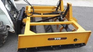 Land Plane with rippers mounted on Bobcat skid steer