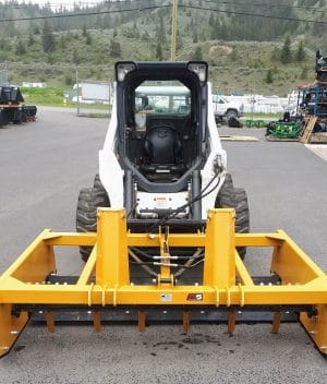 Land Plane with rippers mounted on Bobcat skid steer