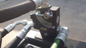 Remlinger Screening Bucket mounted on a skid steer showing adjustable hydraulic flow mechanism