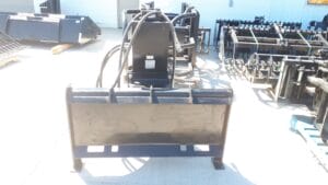 Skid steer mounted post pounder rear view