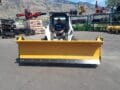 HLA snow wing 9-14 ft attached to Bobcat skid steer