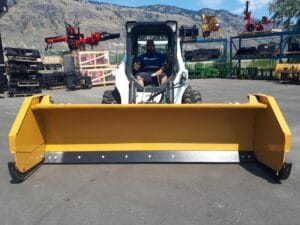 HLA snow wing 9-14 ft attached to Bobcat skid steer