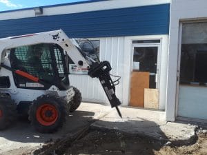 Shearforce SM5 breaker mounted on bobcat skid steer