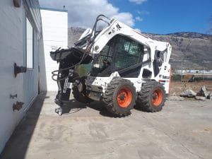 Shearforce SM5 breaker mounted on bobcat skid steer