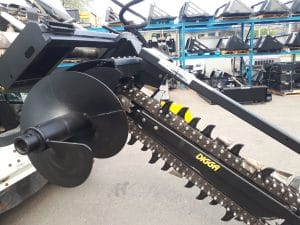 Digga skid steer trencher mounted on a skid steer side view