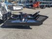 Martatch brush mower mounted on Bobcat skid steer side view