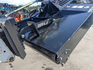 Martatch brush mower mounted on Bobcat showing floating linkage