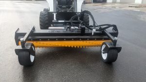 Front view Erskine Soil Conditioner mounted on skid steer