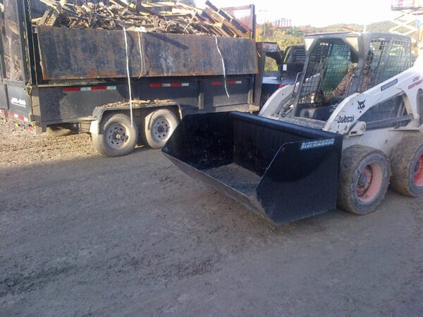 DumpsterBucket_2 dumpster bucket on bobcat skid steer beside