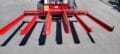 bale accumulator for skid steer